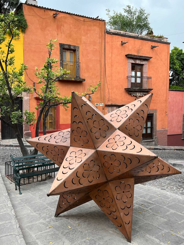 large metal small stellated dodecahedron on street corner 1 block south of Parrochia church; San Miguel de Allende, Mexico