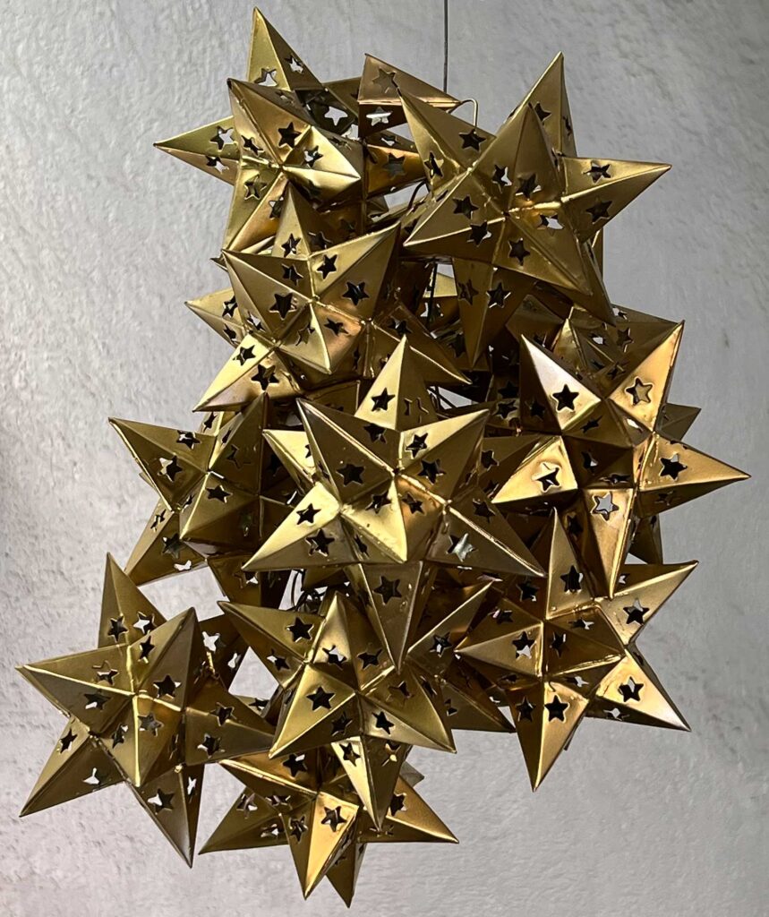cluster of brass Small Stellated Dodecahedra; San Miguel de Allende, Mexico