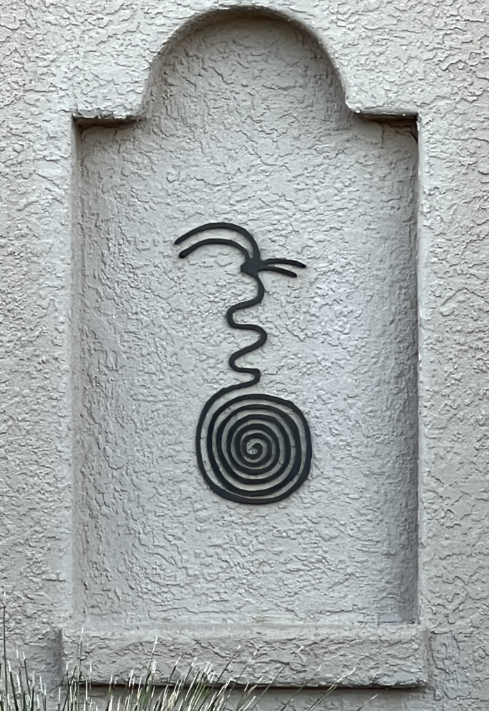 spiral petroglyph metal wall art
